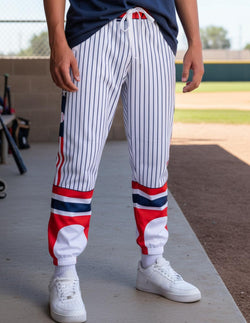 White baseball lounge pants featuring classic blue pinstripes and red and blue graphic cuffs.