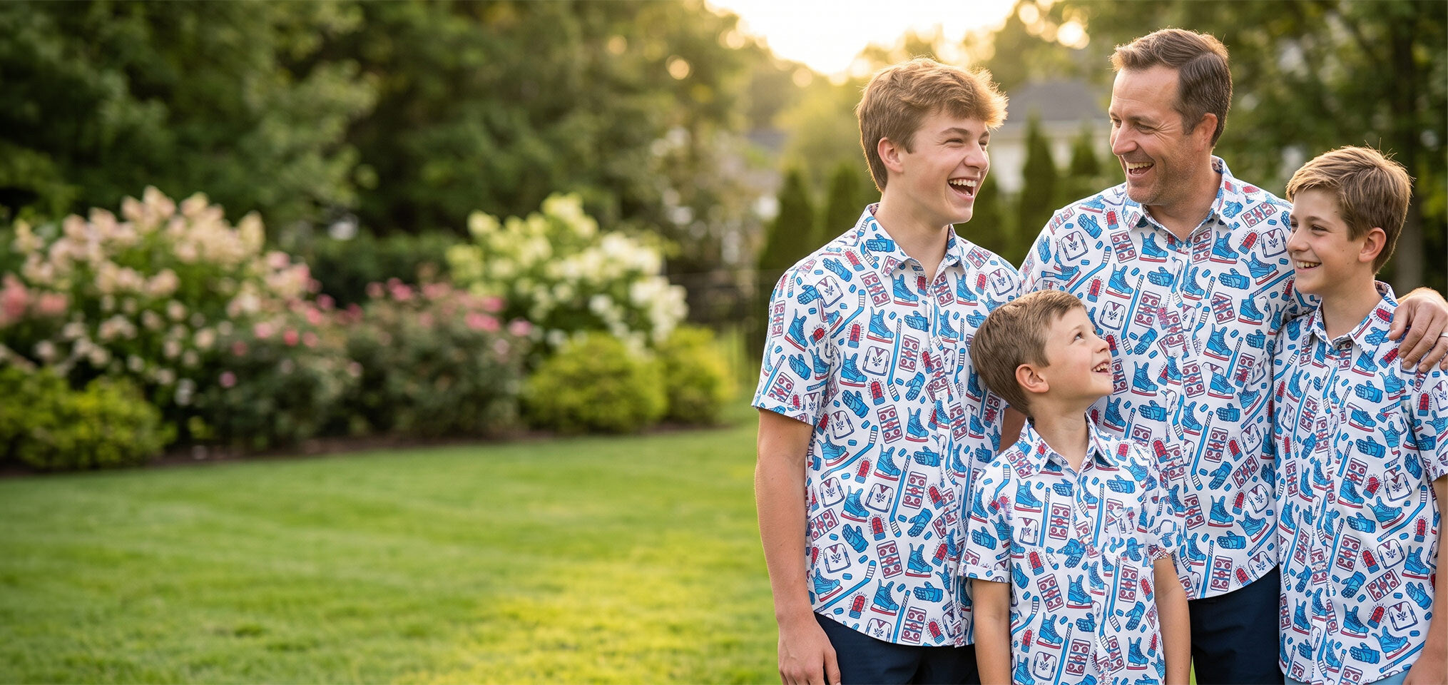 Family of four wearing matching blue and white hockey patterned polo shirts outdoors.