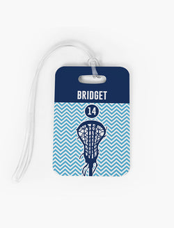 Personalized lacrosse bag tag featuring blue chevron pattern, stick graphic, and custom name.