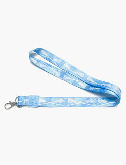 Blue girls lacrosse lanyard featuring a white crossed sticks pattern and metal clasp.