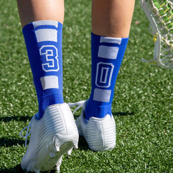 Blue lacrosse team number socks featuring white number 30 on the back.