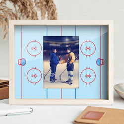 Wooden picture frame featuring a printed blue ice rink design matte with vertical slot for hockey photos.