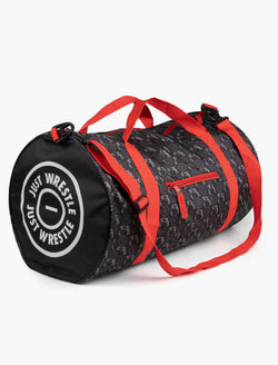 Black wrestling duffle bag with red straps featuring "Just Wrestle" circle logo and wrestler pattern.
