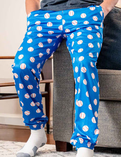 Teen wearing blue baseball lounge pants featuring a repeating white baseball pattern design.