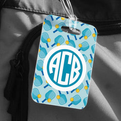 Light blue pickleball bag tag featuring a repeating paddle pattern and personalized monogram.
