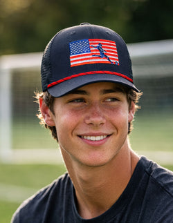 Person wearing a cap with an American flag soccer design outdoors