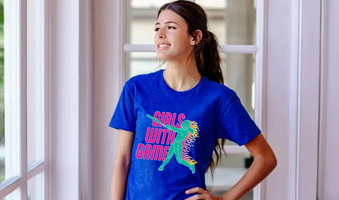 Woman wearing a blue t-shirt with 'Girls with Game' softball graphic design