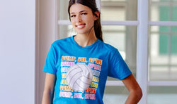 Girl wearing turquoise volleyball t-shirt featuring colorful "Bump, Set, Spike" text and a large volleyball graphic.