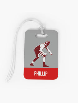 Gray and red custom wrestling bag tag featuring a wrestler silhouette and personalized name.