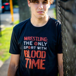 Youth wearing black wrestling t-shirt with red and white "Wrestling: The Only Sport With Blood Time" Halloween text.