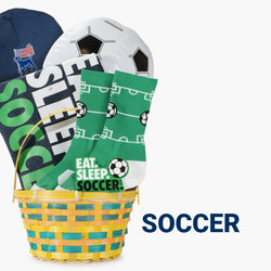 Easter basket filled with soccer themed items including a t-shirt, socks, a sticker, a patriotic classic performance hat, and an inflatable soccer ball