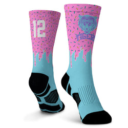 Two socks with pink and blue design on a white background