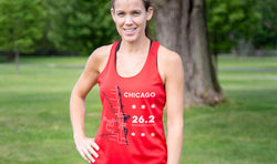 Woman wearing red Chicago 26.2 Marathon running tank top with course map and star graphic design.