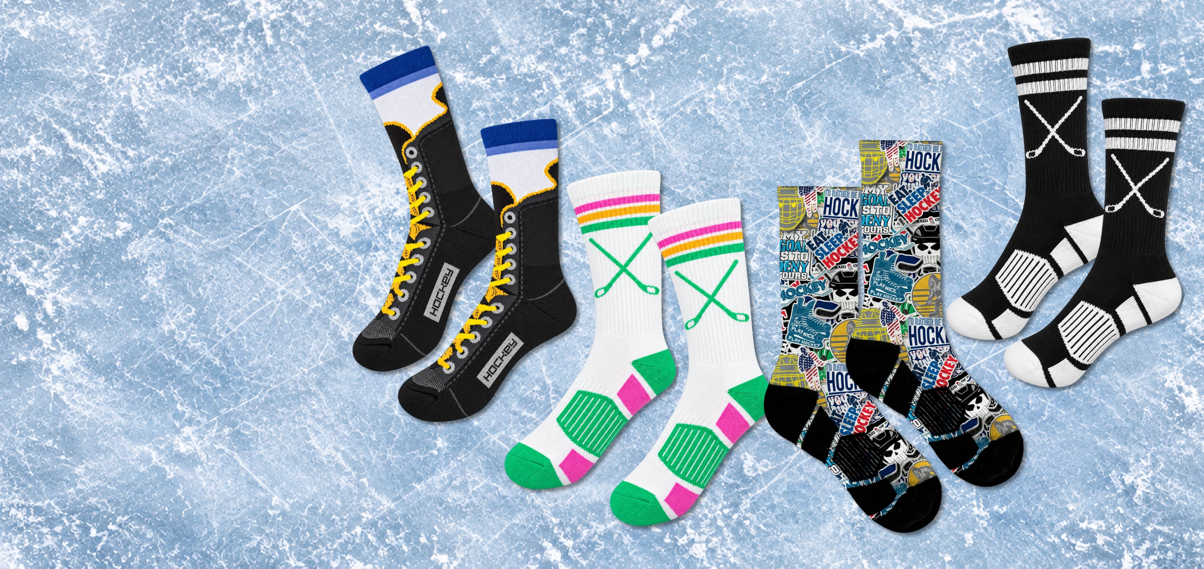 Six pairs of novelty crew socks arranged in a row on a light blue ice texture background. The socks feature various designs including a black and yellow hockey theme, white with pink and green accents, and a busy multicolor cityscape pattern.