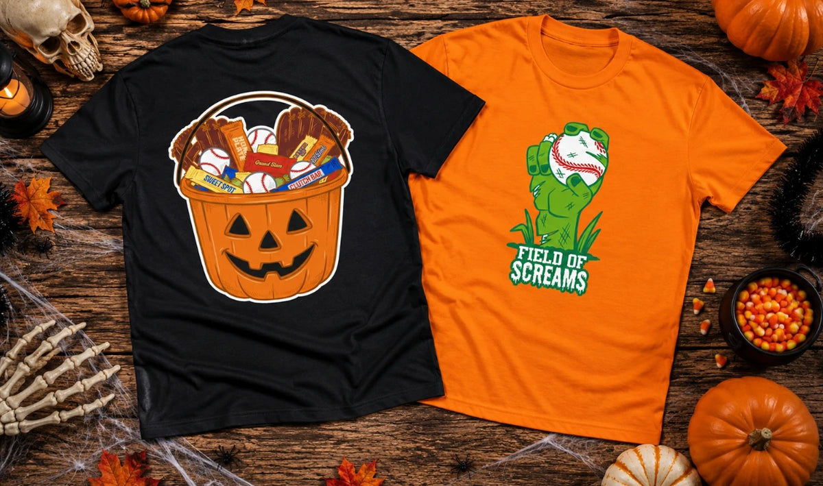 Two Halloween-themed graphic t-shirts displayed on a rustic wooden background surrounded by seasonal props