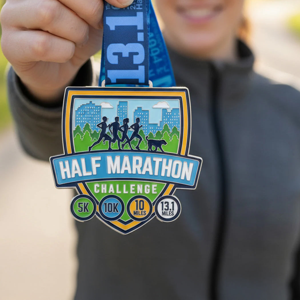 Person holding a half marathon challenge medal with a cityscape design.