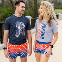 Patriotic running apparel collection featuring graphic t-shirts and red, white, and blue star-patterned shorts.