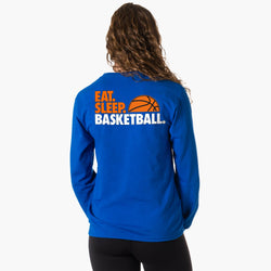 Person wearing a blue sweatshirt with 'Eat Sleep Basketball' text on the back.