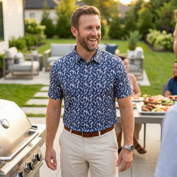 Man wearing a blue basketball patterned polo shirt at a bbq