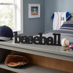 Bedroom with 'baseball' sign, baseball cap, glove, and sports jersey.
