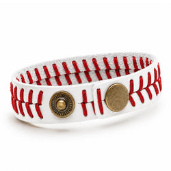 A white leather bracelet designed to look like baseball stitching, featuring red thread and two antique bronze metal buttons on a white background.