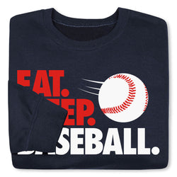 Folded navy blue sweatshirt with red and white graphic of a baseball and text on a white background