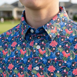 Cloase up of a polo shirt with tropical baseball pattern.