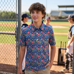 Person wearing a tropical patterned baseball polo shirt at a baseball field.