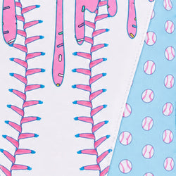Close-up of a fabric product showing a playful baseball-themed ice cream print with pink baseball stitches on a white background and a light blue section with pink baseball dots.