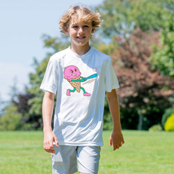 Child wearing a white t-shirt with a colorful ice cream cone graphic outdoors.