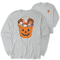 A heather gray long-sleeve t-shirt shown from both the front and back. The back features a large graphic of a jack-o'-lantern bucket filled with candy and baseball gloves, and the front has a small matching graphic on the left chest.