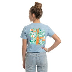 Person wearing a light blue t-shirt with a cheer graphic design on the back, standing against a white background.
