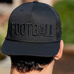 Black cap with 'FOOTBALL' text worn by a person, blurred background