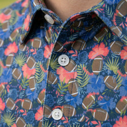 Close-up of a colorful polo shirt with football and floral pattern