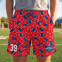 Red shorts with football pattern and number 39 on a sports field background