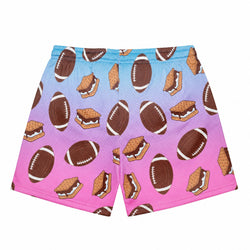 A pair of shorts featuring a football mesh pattern with a blue-to-pink gradient background and an all-over print of brown footballs and graham cracker s'mores.