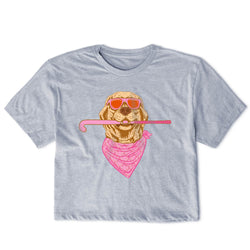 A light heather gray short-sleeve t-shirt with a graphic of a golden retriever wearing pink sunglasses, a pink bandana, and holding a pink field hockey stick.