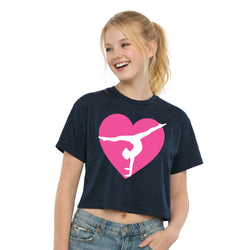 Girl wearing a navy t-shirt with a pink heart and white gymnast design on a white background