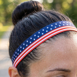 Person wearing a headband with American flag design outdoors