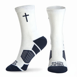 A pair of white crew socks with navy blue accents, including a cross on the upper sock and textured navy heel and toe sections, shown against a plain white background.