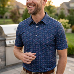 Man wearing a hockey patterned polo shirt outdoors at a bbq.