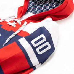 Close-up of a sports jersey sleeve with red, white, and blue colors and number