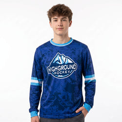 Person wearing a blue 'Highground Hockey' jersey on a white background