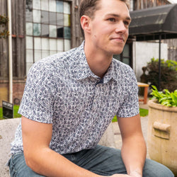 Model wearing short sleeve Hockey Time performance polo