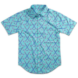A short-sleeve button-up shirt in a light aqua blue color, featuring an all-over repeating pattern of crossed hockey sticks and hockey pucks in blue, pink, and white.