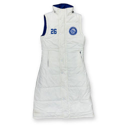 A white sleeveless puffer vest with a high collar, featuring blue trim on the inner armholes, a blue number '26' on the right chest, and a circular blue crest on the left chest.