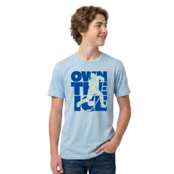 Person wearing a light blue t-shirt with a hockey graphic design on a white background