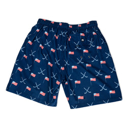Navy swim shorts with American flag and hockey pattern on a white background