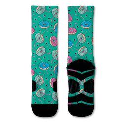 Teal socks with colorful hockey-donut pattern on a white background