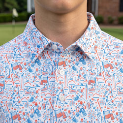 Close up of a person wearing a patrioic themed polo shirt with hockey pattern design.